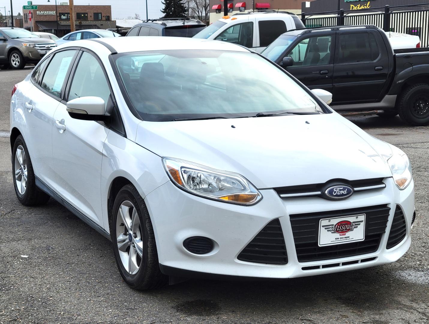 2013 White /Black Ford Focus SE (1FADP3F23DL) with an 2.0L I4 engine, 6 Speed Automatic transmission, located at 450 N Russell, Missoula, MT, 59801, (406) 543-6600, 46.874496, -114.017433 - Great Little Sedan. Excellent Fuel Economy. Only 69K Miles! Heated Seats. Air Cruise Tilt. Power Windows and Locks. AM FM CD XM Bluetooth. - Photo#3